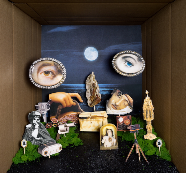 Photo-collage diorama featuring a surreal landscape with two large eyes hovering over various antique objects referencing religion, the body, and photography