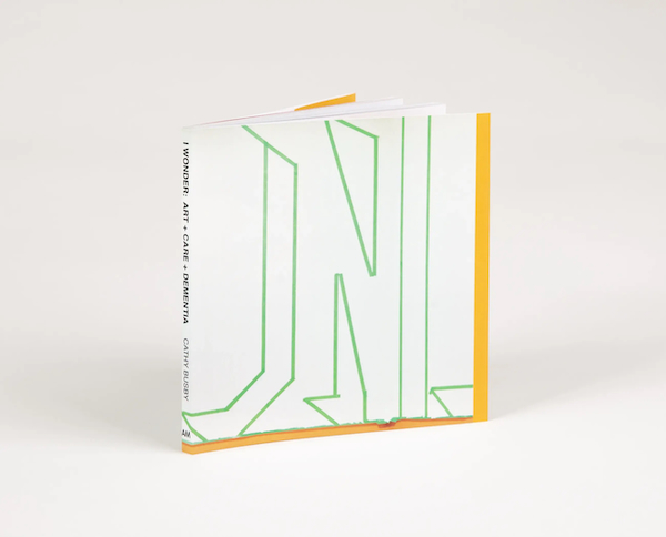 A square artist's book titled I WONDER: Art+Care+Dementia by Cathy Busby.